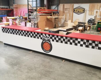 Pitstop Pizza got custom graphics on this custom counter. What can IRE, Inc. customize for YOUR business?